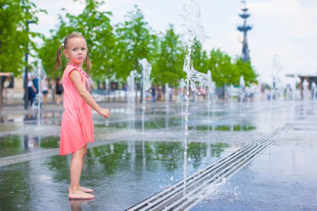 Adorable girl have fun at hot sunny summer day