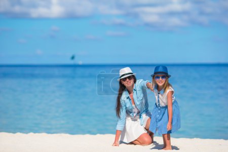 Mother and daughter enjoying time at tropical beach