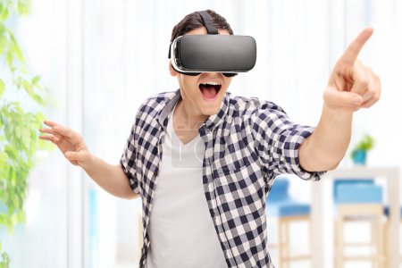 Young man experiencing virtual reality 