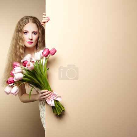 Portrait beautiful woman with bouquet of flowers