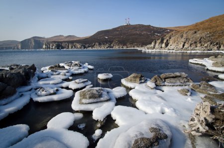 Winter sea, ice stones, frozen water, seascape