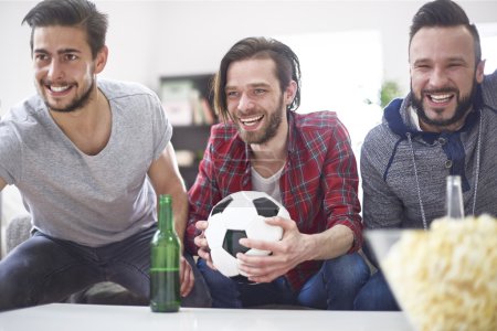 Men watching a soccer match
