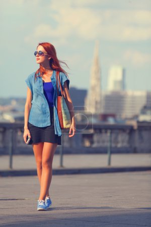 Modern girl walking on the street in Brussels
