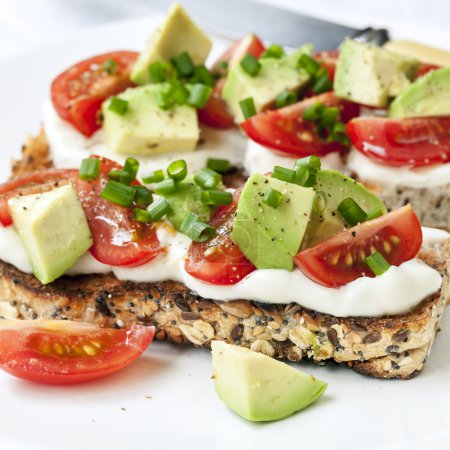 Toast with Avocado Tomatoes and Cream Cheese