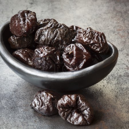 Prunes in Black Bowl