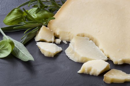 Gruyere Cheese with Herbs on Dark Slate