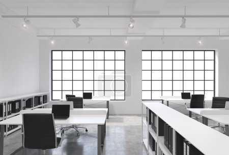 Workplaces in a bright modern loft open space office. Tables equipped with laptops; corporate documents' shelves. White copy space in the panoramic windows. 3D rendering.