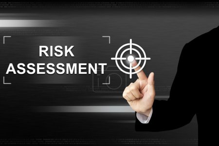 business hand pushing risk assessment button on touch screen