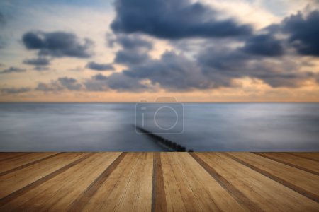 Beautiful long exposure vibrant concept image of ocean at sunset