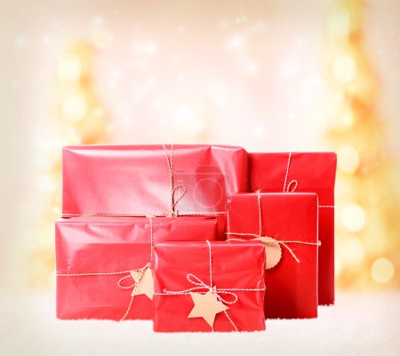 Gift boxes on Christmas trees background