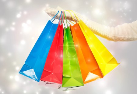 Woman holding colorful shopping bags