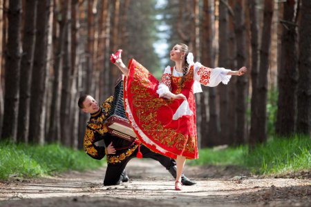 Couple of dancers in russian traditional costumes