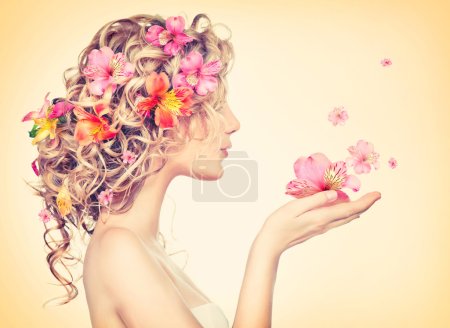 Girl with flowers in hands
