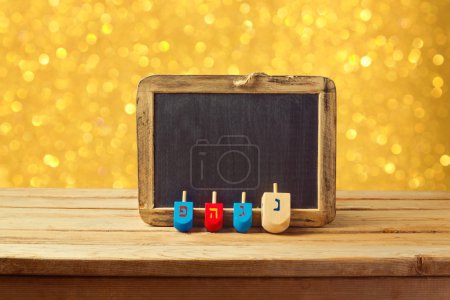Wooden spinning top and chalkboard