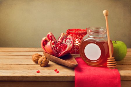 Pomegranate and honey for Rosh Hashanah holiday. Jewish New Year.