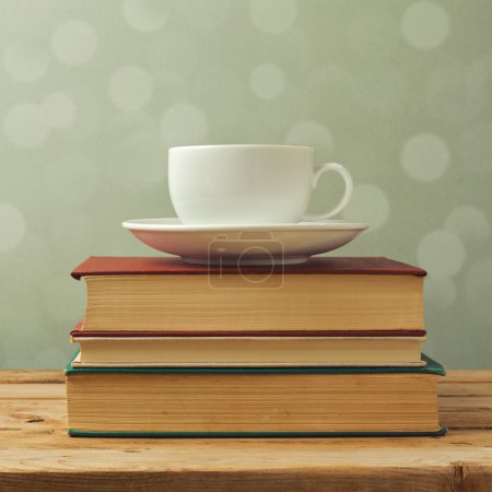 Coffee cup on books