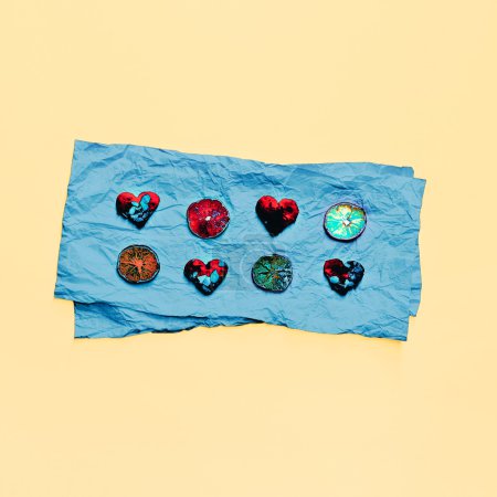 Hearts and lemons on blue paper. design Photo