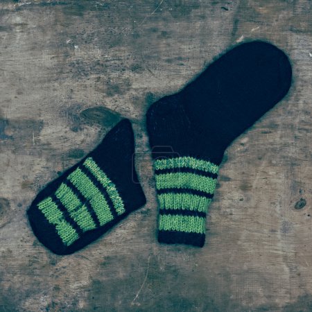 woolen socks on wooden background
