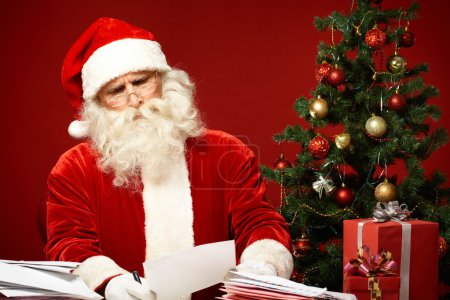 Santa Claus reading letter