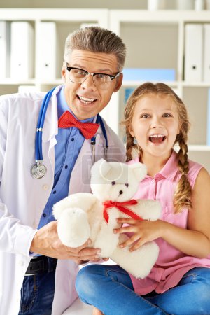Joyful girl and her doctor