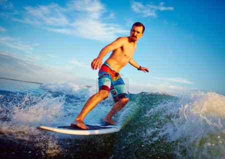 Young man surfboarding