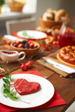 Wooden heart on plate