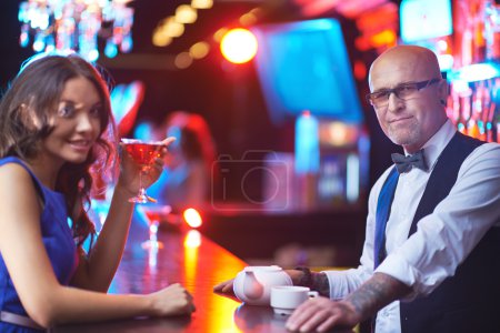 Man in eyeglasses and girl with drink