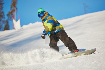 Active sportsman snowboarding