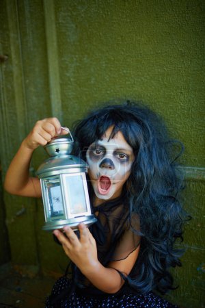 Spooky girl with lantern