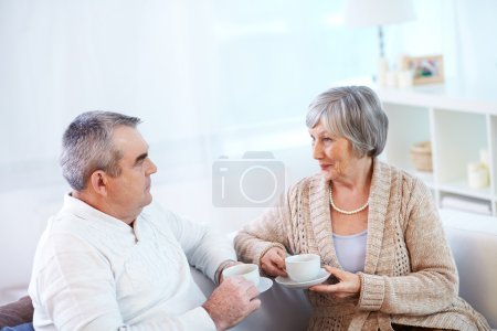 Senior couple with  cup of tea