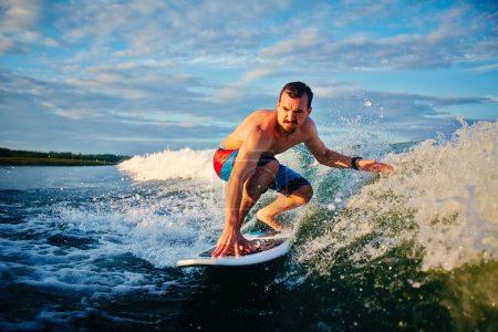 Sportsman surfboarding