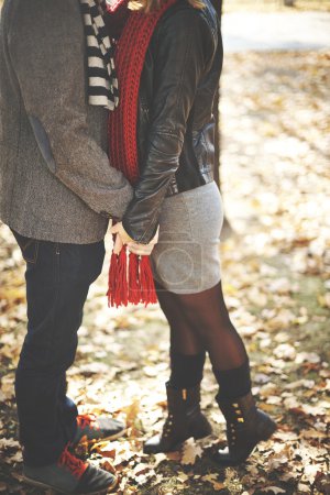 Couple kissing in autumn park