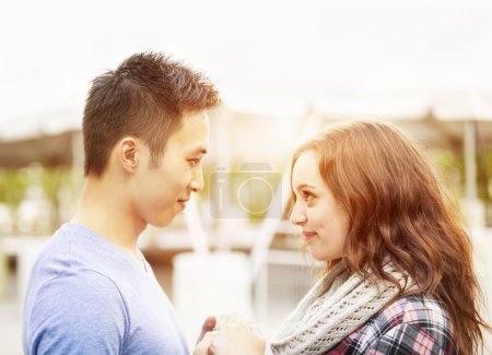 Couple affectionately facing each other
