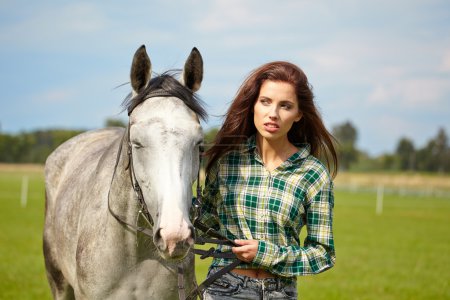 Woman long hair next horse