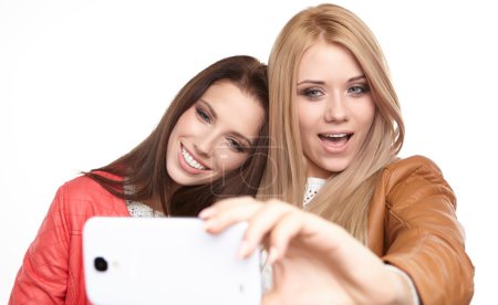 Girls making selfies at studio