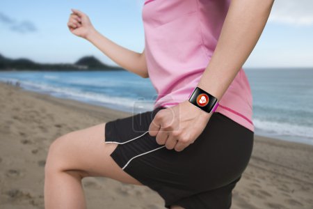 sport female wearing bright pink watchband bent touchscreen smar
