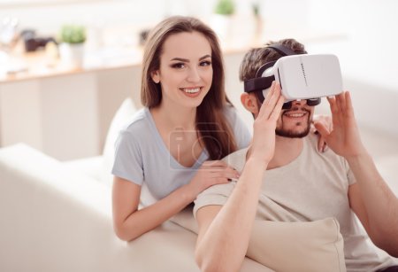 Positive couple using virtual reality device