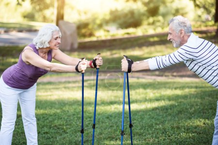 Old friendly couples sports training in nature