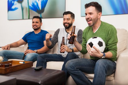 men watching a soccer game