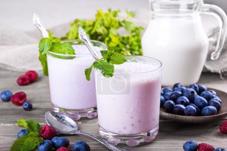 Milkshake with blueberries, raspberries and mint