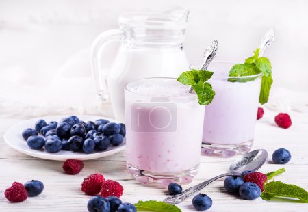 Milkshake with blueberries, raspberries and mint