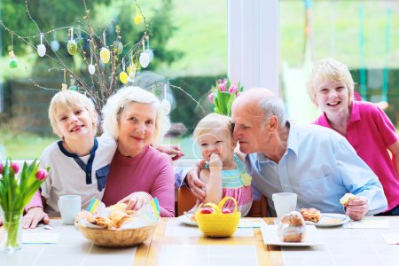 Grandparents with grandchildren enjoying Easter breakfast