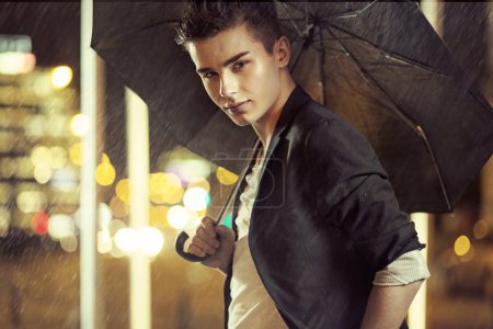 Charming young model with umbrella
