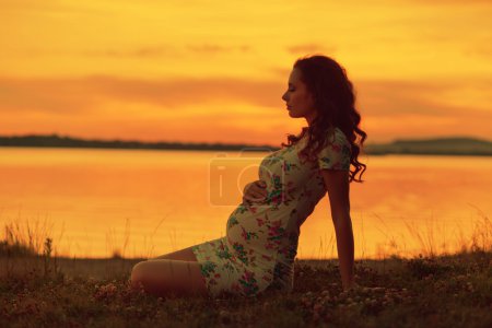Realxed woman looking at the sunset
