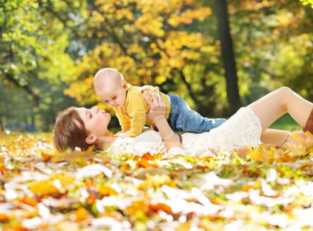 Young mother kissing her baby