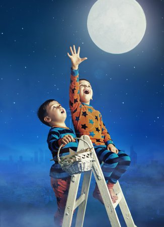 Two little brothers catching the moon