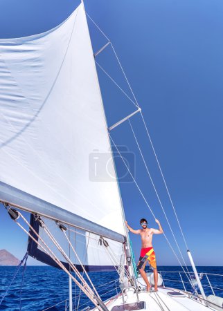 Cheerful man on sailboat