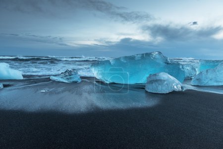 Icebergs on black beach