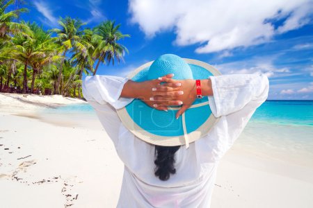 Woman in hat enjoying sun holidays