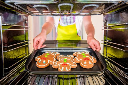 Baking Gingerbread man in the oven